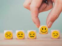 a series of wooden blocks with emoji style emotions
